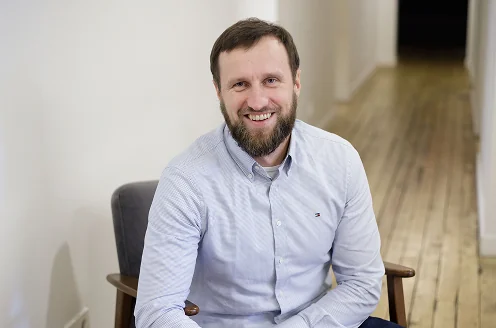 Ricardas Tenene, smiling at camera