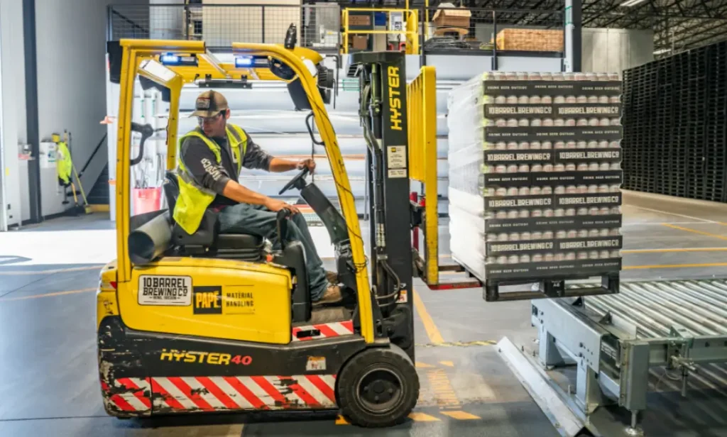 Man operating forklift in Warehouse