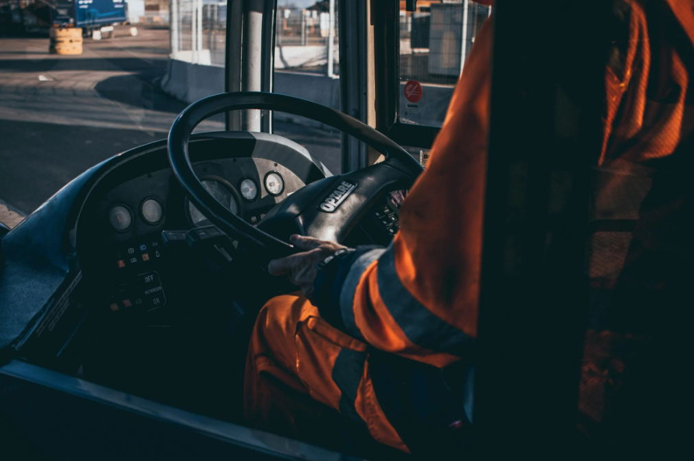 Man Driving Bus in Traffic