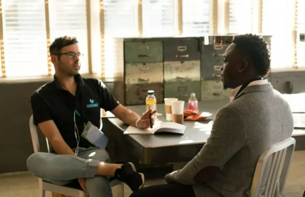 Two recruiters talk about work issues