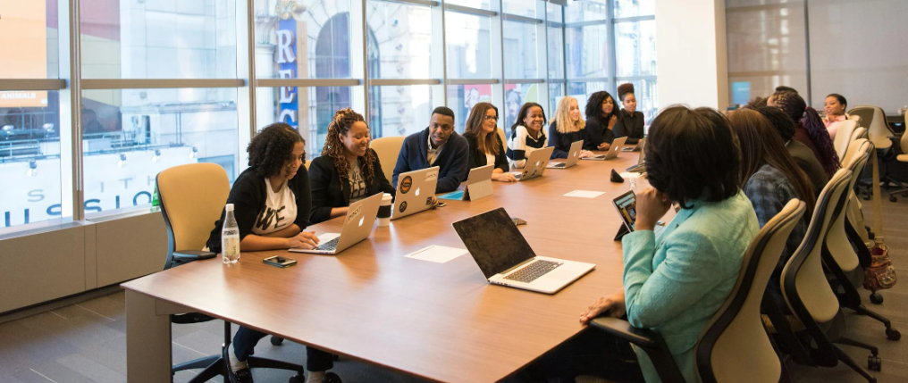 Employment agency experts discussing strategies at table