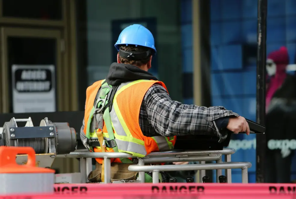 Blue-collar worker working at shipyard