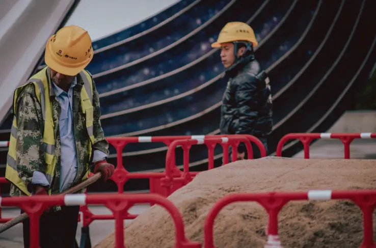 two construction workers talking