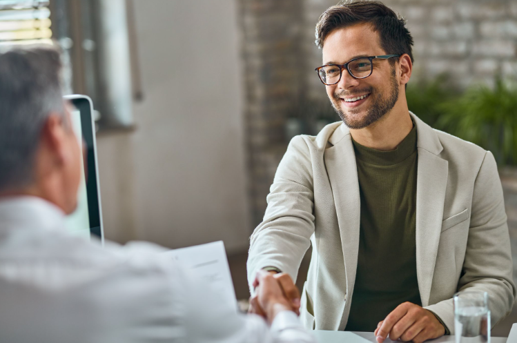 Stock photo of recruiter shaking candidate's hand
