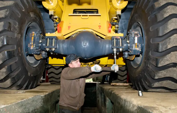 Wroker fixing heavy machinery