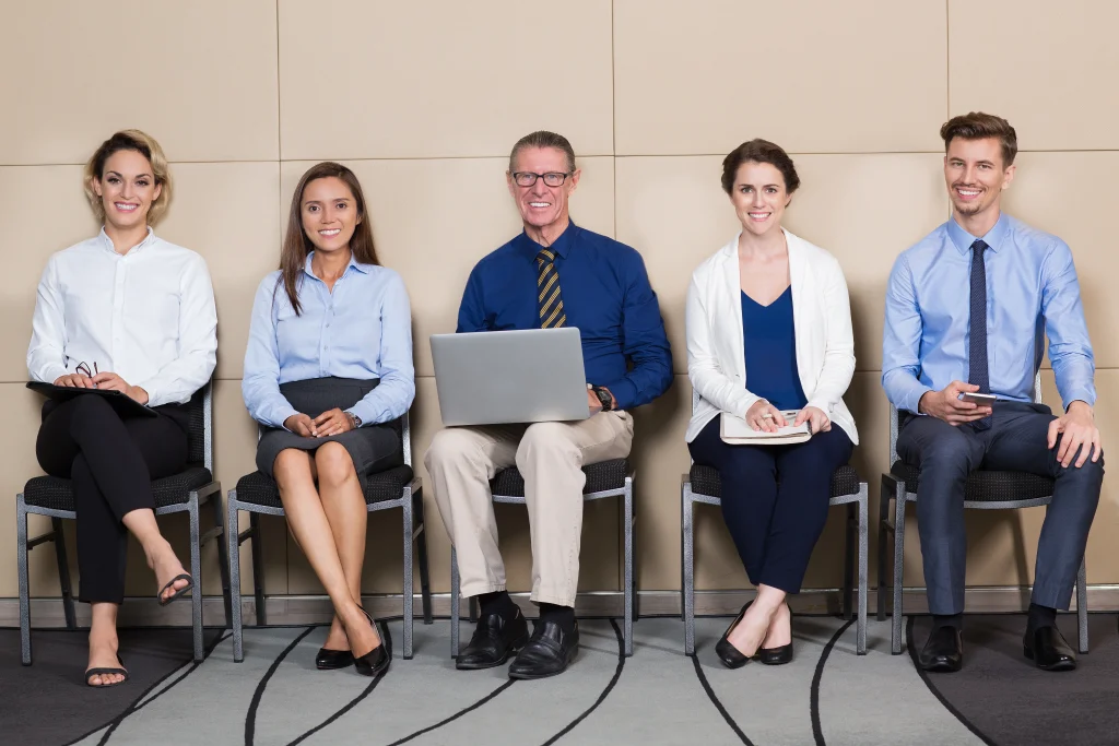 Group of recruiters smiling in front of the camera