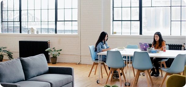2 girls working in the office