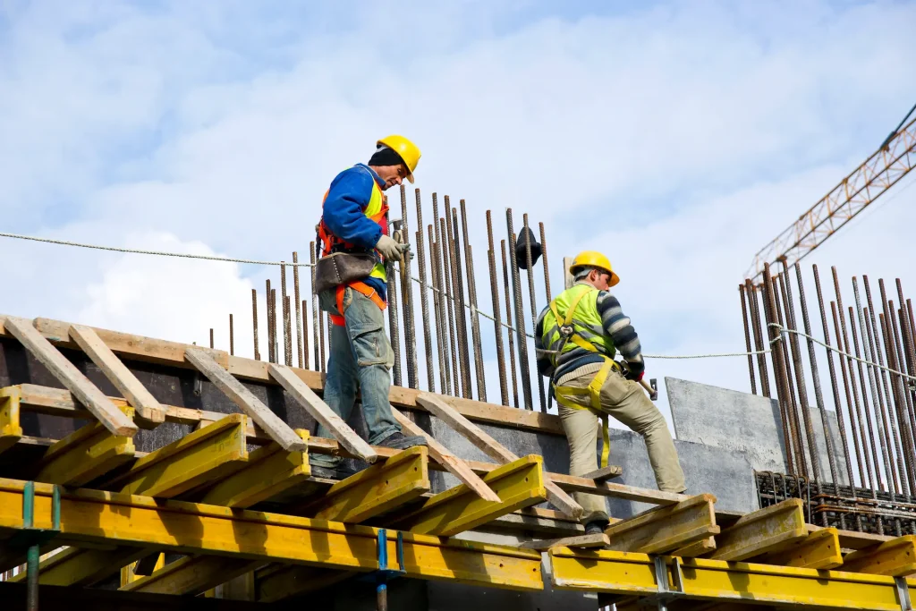 construction workers working up high