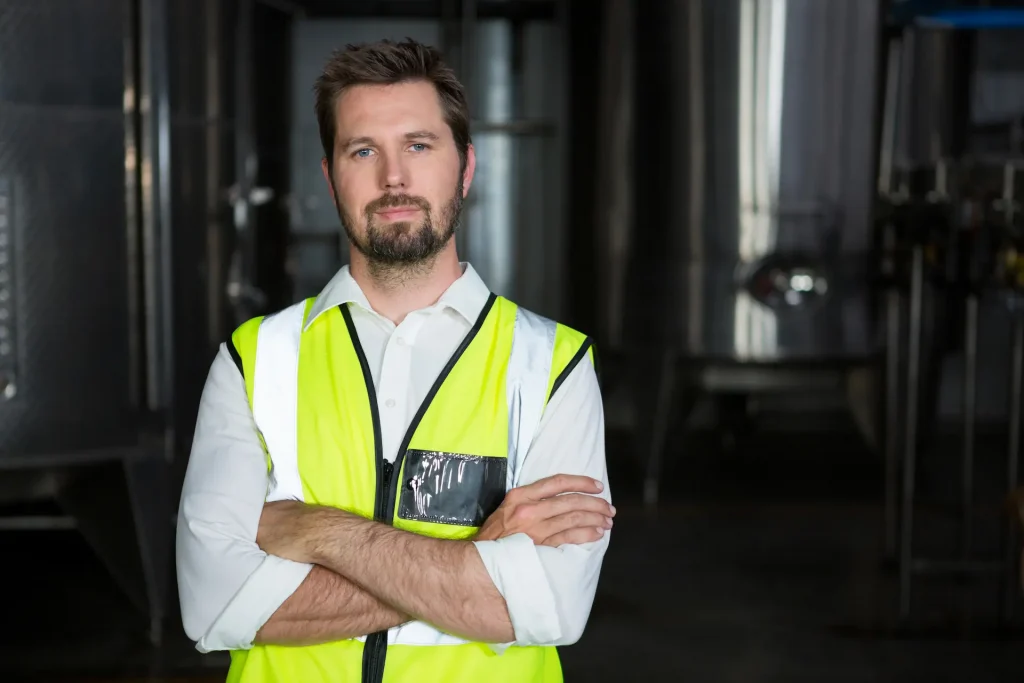 male factory worker with arms crossed