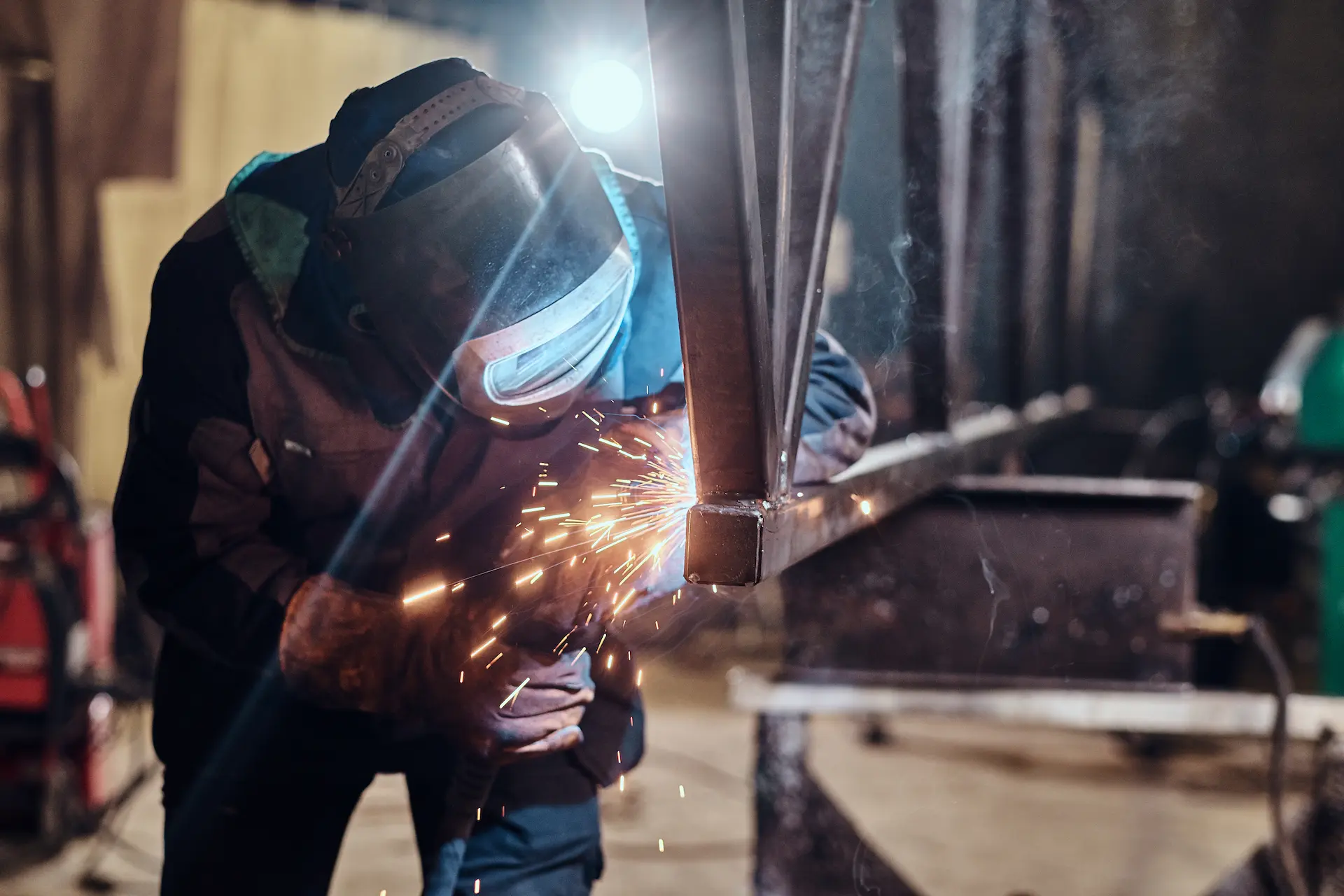 welder working in metal factory